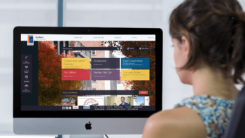 Woman looks at a iMac computer screen