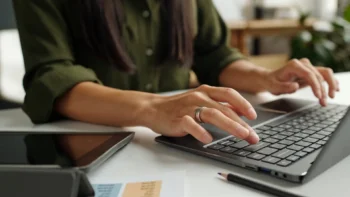 hands on a laptop working