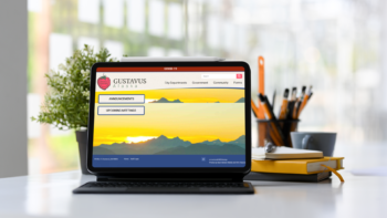 Laptop displaying the Gustavas website homepage