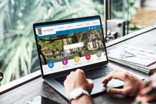 Laptop displaying the website homepage of City of St Augustine