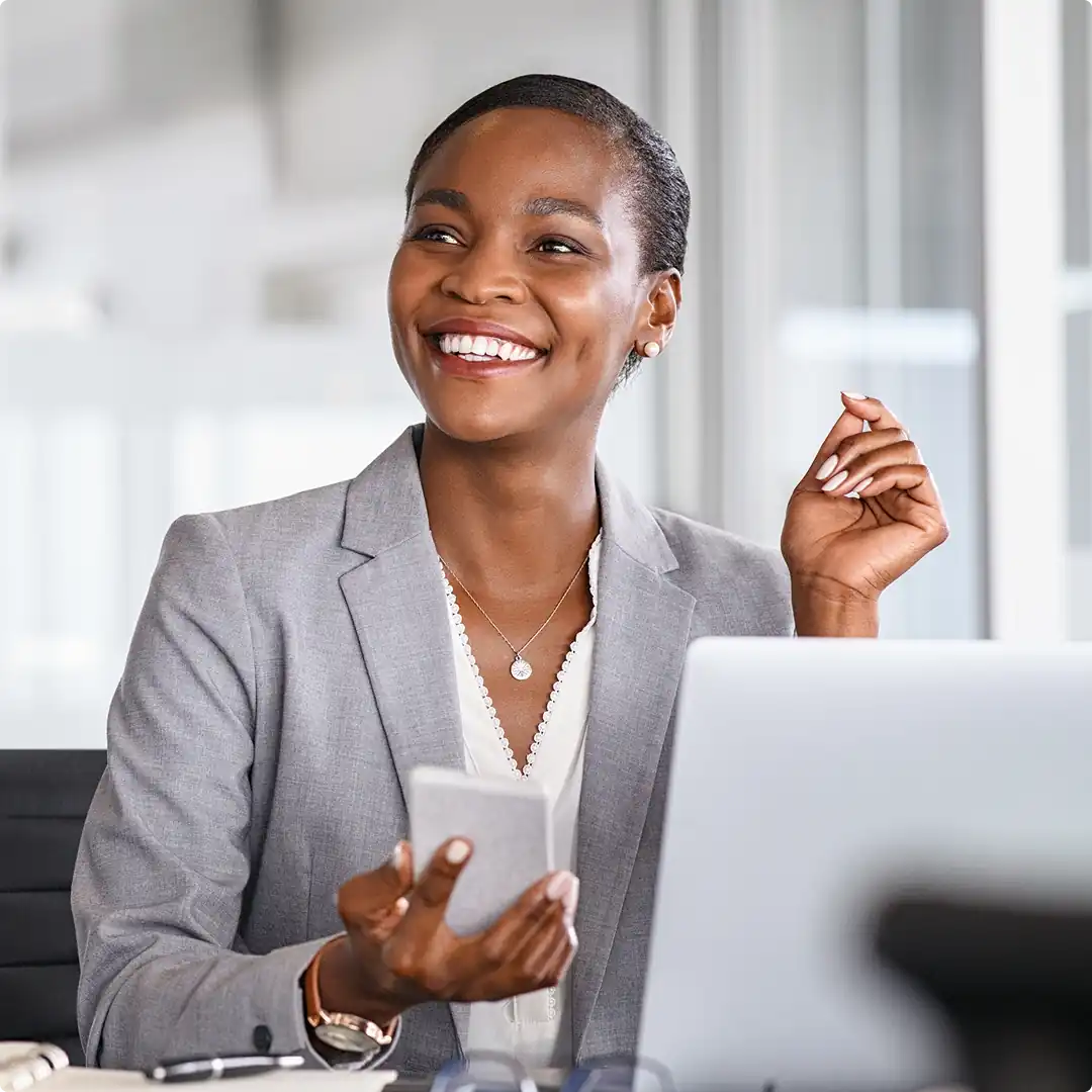 Woman using a phone in an office