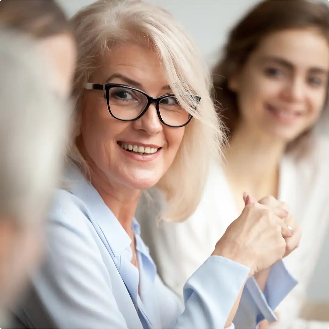 Smiling woman in a meeting