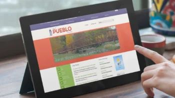 Tablet displaying Pueblo, Colorado website